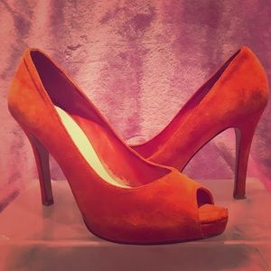 Nine West coral peep toe pumps.